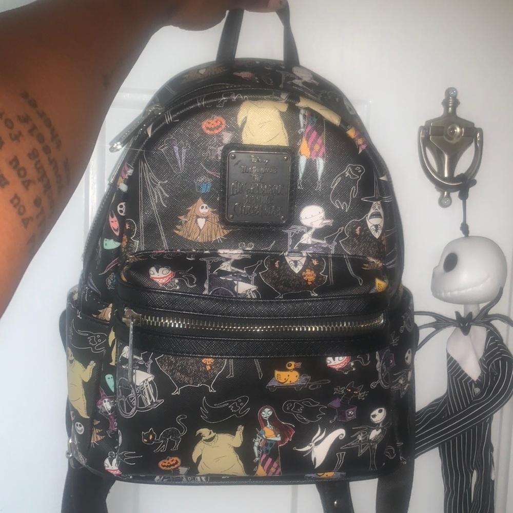 This is a pre owned Nightmare Before Christmas Loungefly backpack.